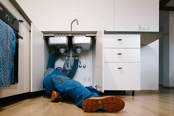 Professional Drain Cleaning technician working in Shelby, MT